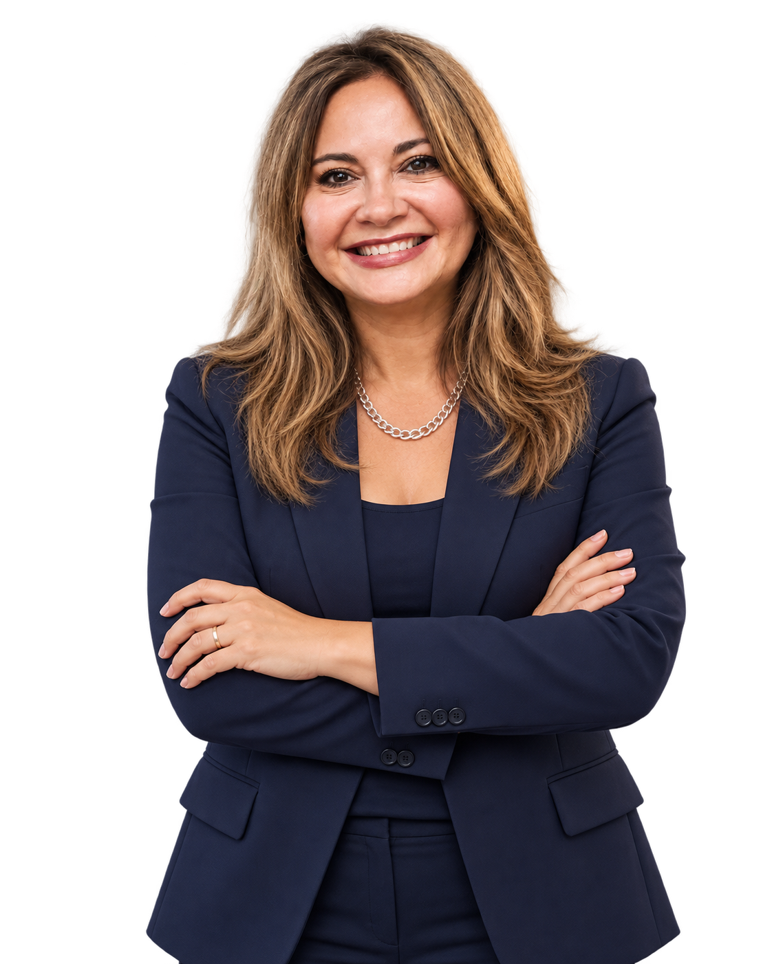 Sil Coria smiling with her arms crossed, wearing a navy blazer